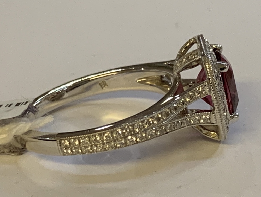 An 18ct white gold diamond and rubellite ring with pierced shoulders and raised platforms, size N, - Image 2 of 4