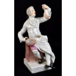 MEISSEN; a mid-18th century figure of a seated cook modelled by JJ Kaendler and Paul Reinicke, circa