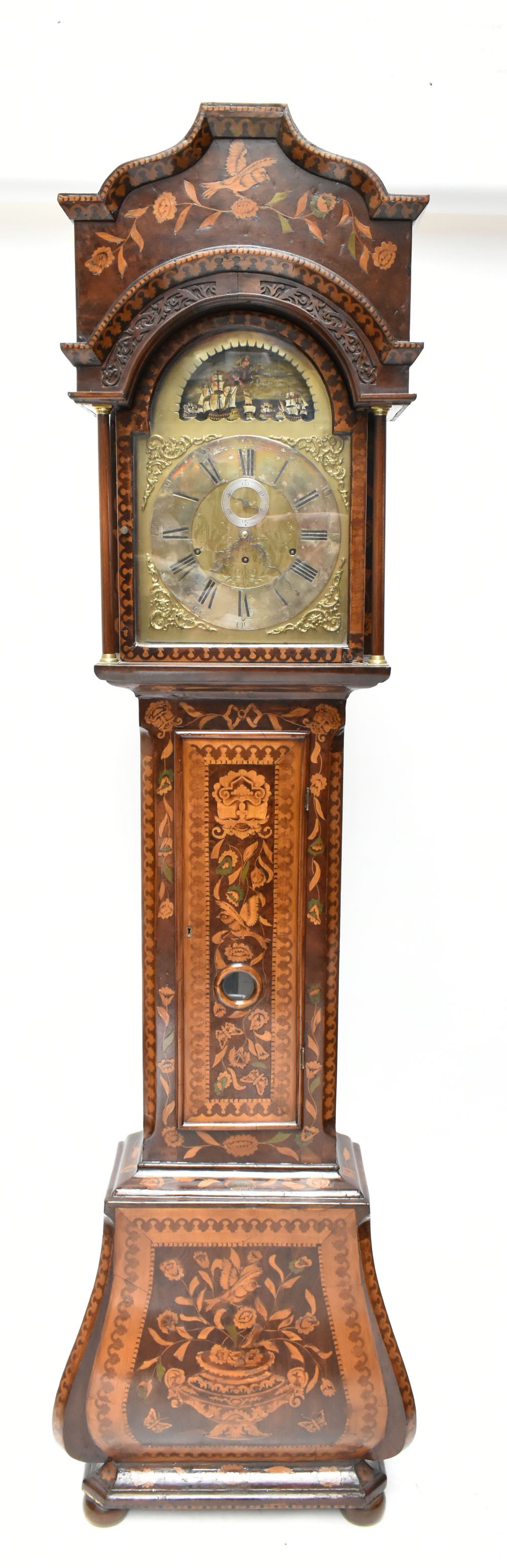 A 19th century Dutch longcase clock, the walnut case with marquetry inlay, the brass face with