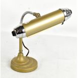 An Art Deco painted metal and chrome adjustable desk lamp, raised on stepped circular base, height