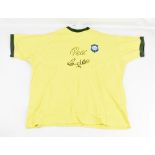 BRAZIL; a cotton replica 1970 home shirt signed by Pelé and Ronaldo, produced by Toffs, stated