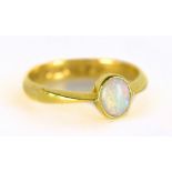 A 22ct yellow gold ring set with oval cut opal, size Q, approx 4.1g.Additional InformationWear