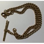 A 9ct yellow gold curb link Albert chain with T-bar, length 37cm, approx 40.9g.Additional