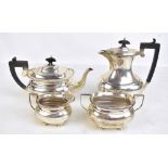 BARKER BROS; a George V hallmarked silver four piece set comprising teapot, length 28.5cm, hot water