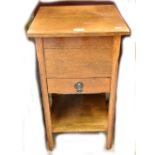 A small oak sewing table.Additional InformationHeight 66cm, width 38cm.