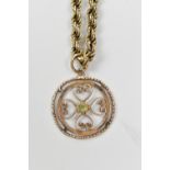 A 9ct yellow gold rope twist necklace supporting a green peridot set circular pendant, combined
