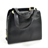 BALLY; a navy leather handbag with gold hardware and embossed logo, 28 x 30 x 13cm.