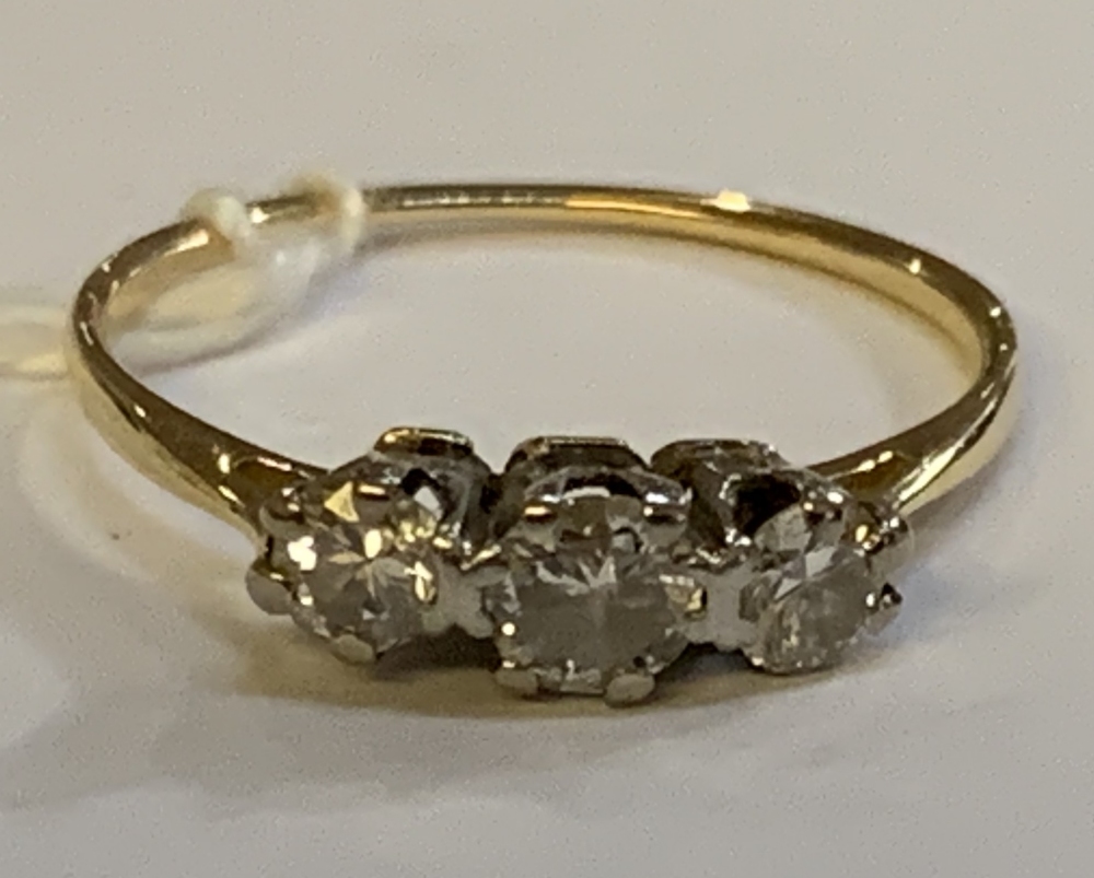 A yellow metal and diamond three stone ring, the central stone weighing approx 0.25ct, size N, - Image 2 of 4