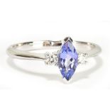 An 18ct white gold tanzanite and diamond three stone ring, size N, approx 2.5g.