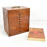 An early 20th century mahogany six drawer dental cabinet purportedly from Manchester Dental