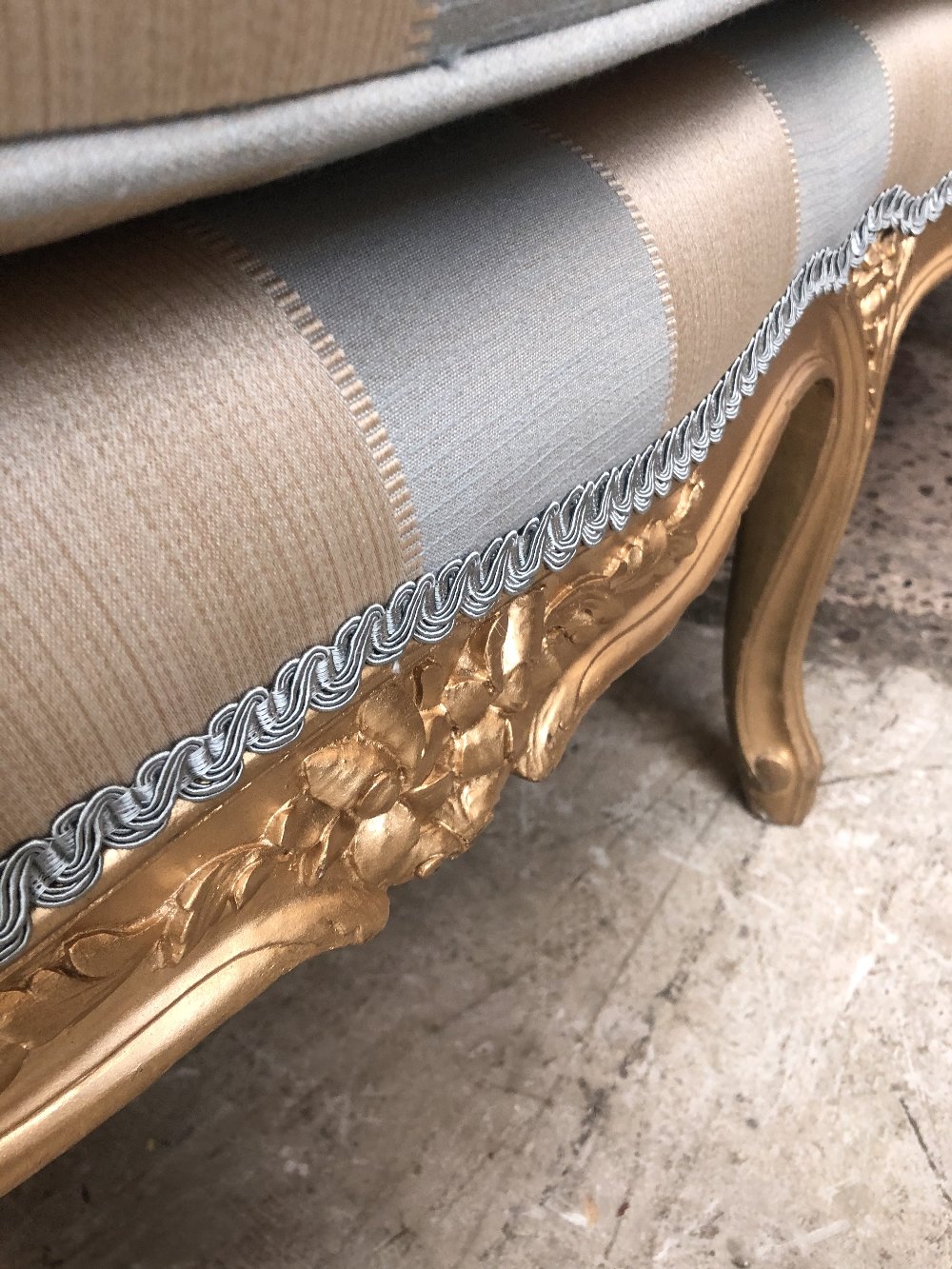 A 19th century gilt wood settee in the French taste with floral carved detail, striped padded back - Image 7 of 7