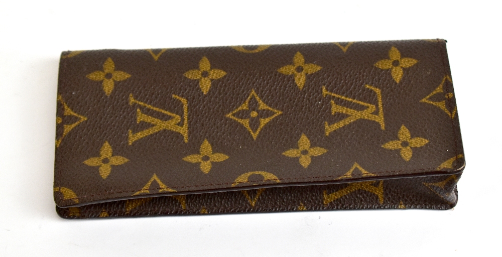 LOUIS VUITTON; a Monogram glasses case, 8 x 16cm, with dust cover.