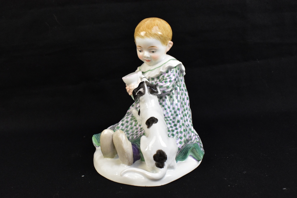 MEISSEN; a 20th century figure group of a young child seated with a puppy at their feet, painted - Image 2 of 6