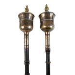 A pair of early 19th century Old Sheffield plate maces with turned ebonised handles, one reduced