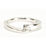 A 9ct white gold diamond solitaire ring with crossover shank, size O, approx 3.8g.