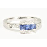 An 18ct white gold sapphire and diamond ring, size K, approx 3.4g.