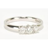 A 9ct white gold and diamond three stone ring, with total diamond weight approx 0.33cts, size L 1/2,