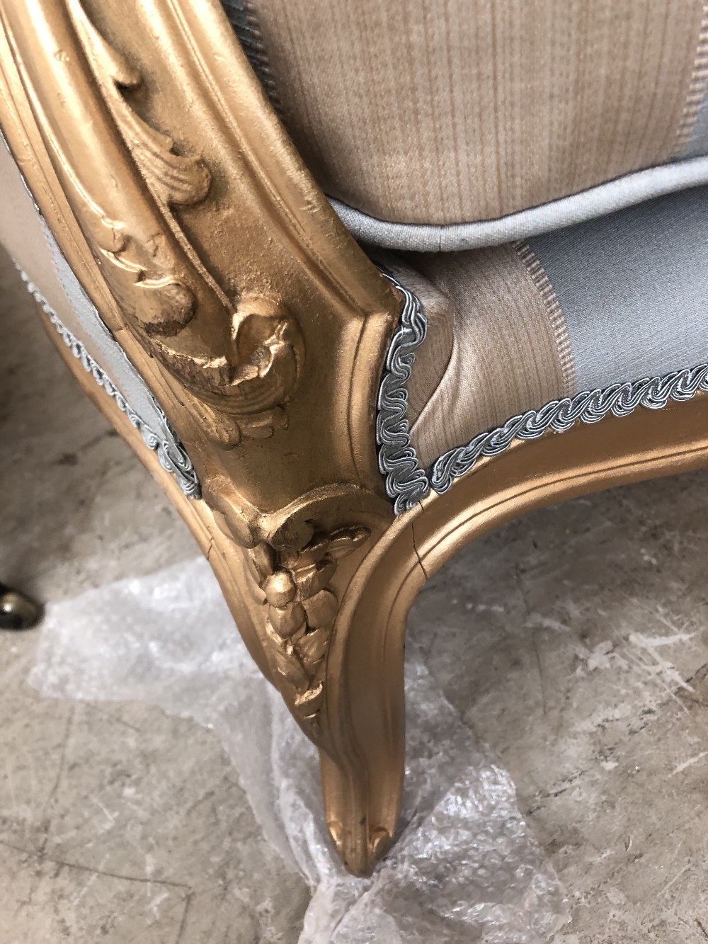 A 19th century gilt wood settee in the French taste with floral carved detail, striped padded back - Image 6 of 7