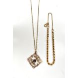 A yellow metal garnet and seed pearl pierced pendant suspended on a 9ct yellow gold fine link chain,