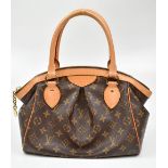 LOUIS VUITTON; a Tivoli Monogram Canvas GM handbag, with leather rolled handles, a zip closure and