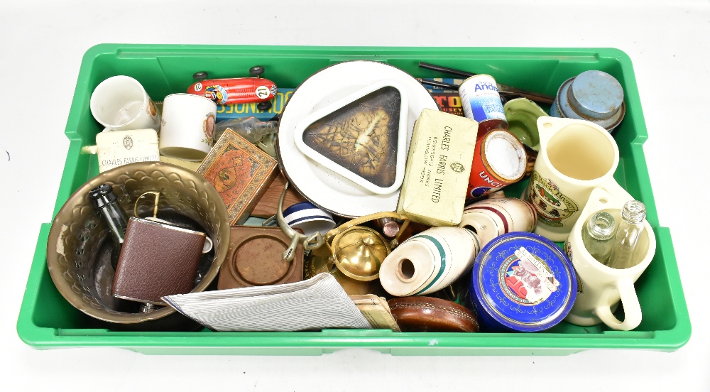 A mixed group of collector's items including tins, bottles, boxes, tape measure, a tin plate toy