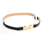 GUCCI; a black leather and gold buckle belt with gold hardware, 80cm, with box.Additional