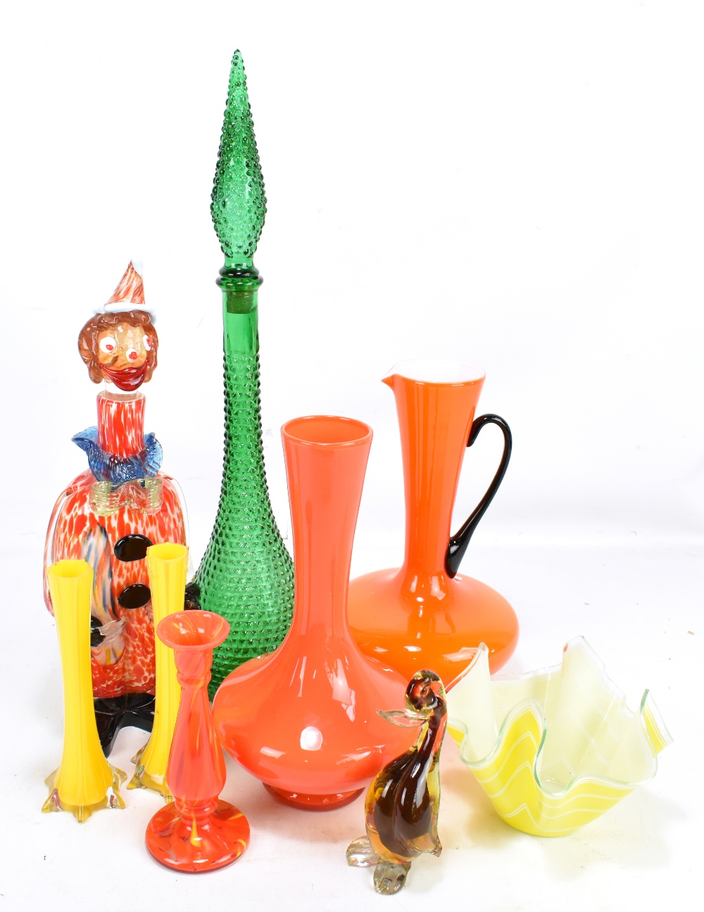 A group of art glass including yellow and clear glass cased pair of vases, orange ewer and vase,