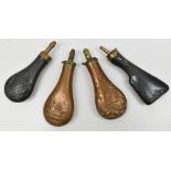 Four 19th century copper powder flasks to include example modelled in the form of a rifle butt,