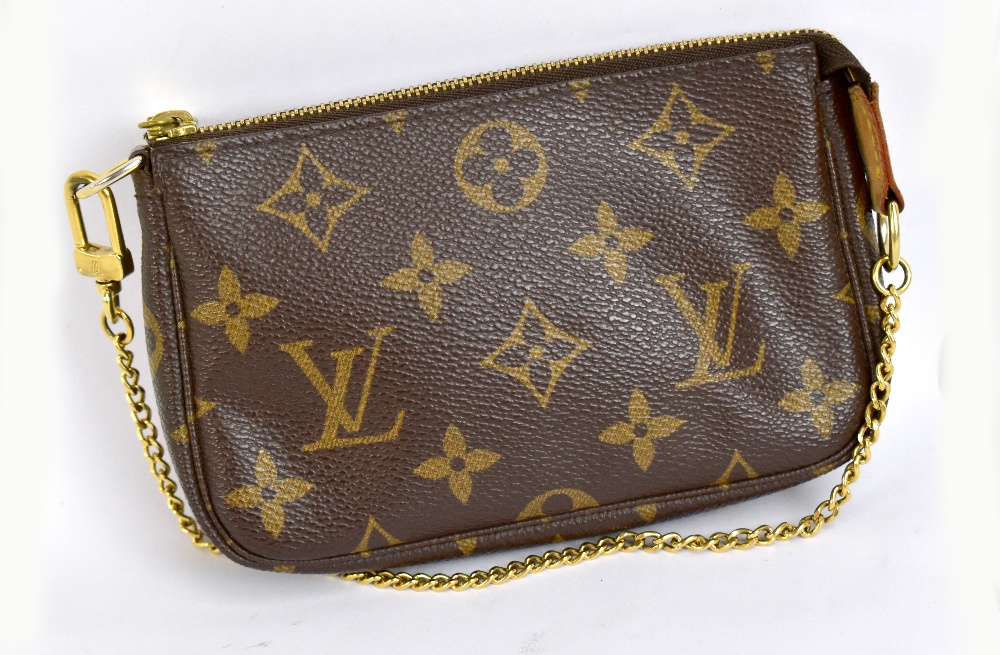 LOUIS VUITTON; a Monogram canvas brown leather evening bag, with gold-tone chain link strap, with