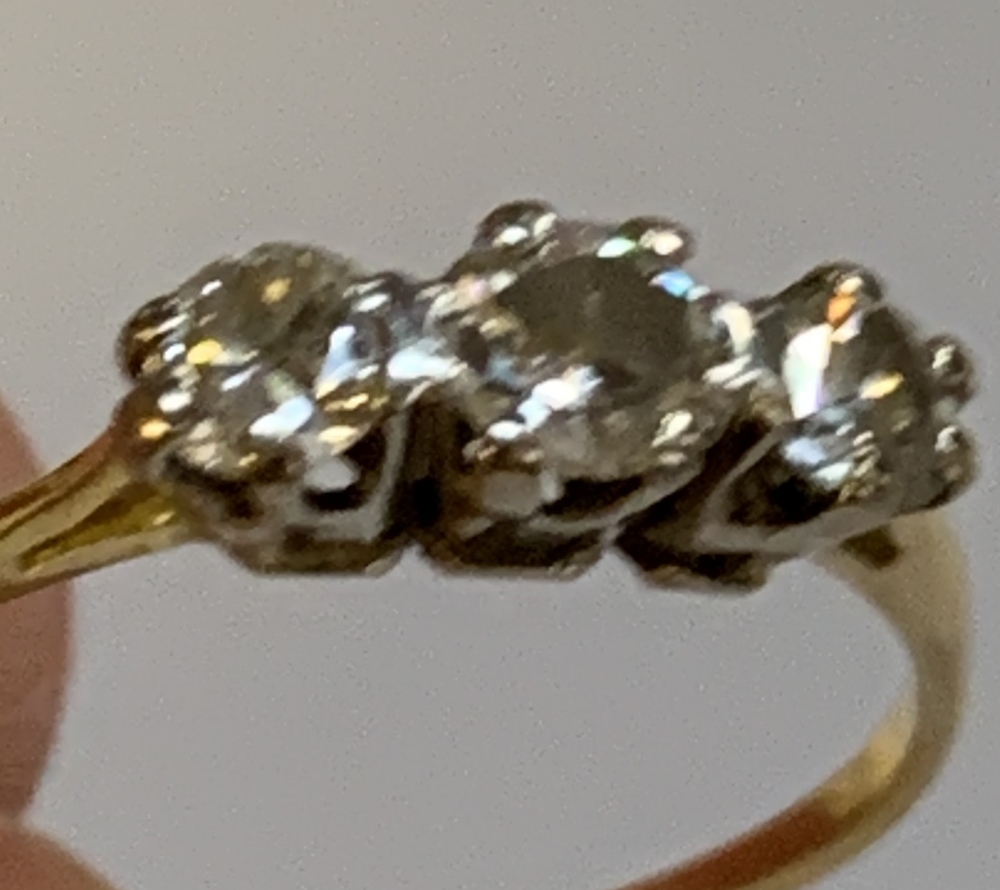 A yellow metal and diamond three stone ring, the central stone weighing approx 0.25ct, size N, - Image 4 of 4