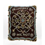 An Edwardian bead decorated pin cushion inscribed to top 'Forget me Not' with floral design, further