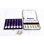 JW TIPTAFT & SON LTD; a cased set of six George V hallmarked silver coffee spoons with green