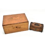 A Victorian marquetry inlaid vanity box, the hinged cover enclosing fitted compartments, with four