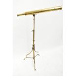 NEGRETTI & ZAMBRA OF LONDON; 'The Gillie' a brass three draw telescope raised on telescopic stand,