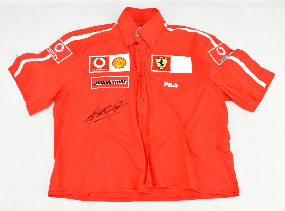 MICHAEL SCHUMACHER; a signed Ferrari Fila shirt, child sized.