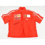 MICHAEL SCHUMACHER; a signed Ferrari Fila shirt, child sized.