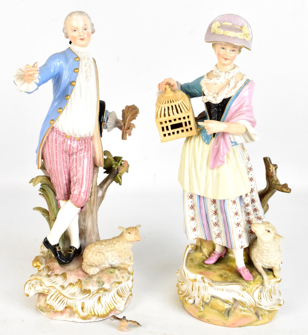 DRESDEN; a pair of late 19th century figures of a dandy and his companion, both with painted blue