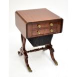 A Regency mahogany dropleaf work table, the first drawer enclosing a leather writing slope and pen