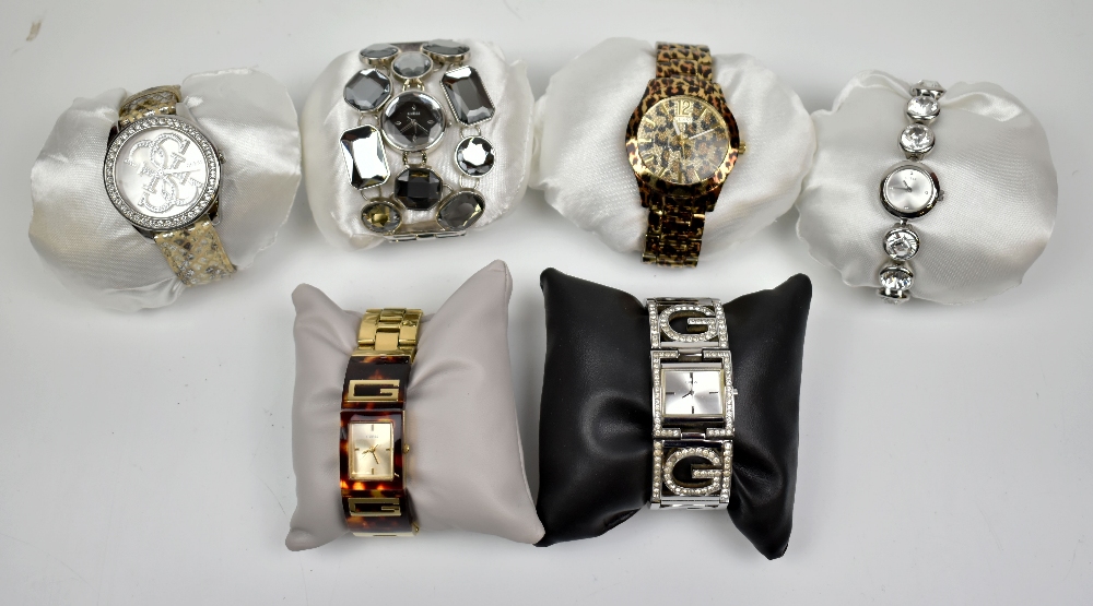 GUESS; a group of six modern fashion watches.