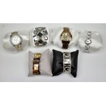 GUESS; a group of six modern fashion watches.