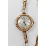 A lady's vintage 9ct yellow gold wristwatch with circular silvered dial set with Arabic numerals