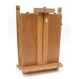 A travelling/portable easel with fitted tray to interior.