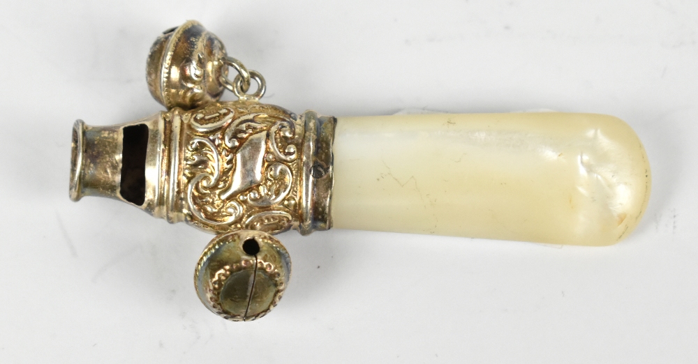 A silver and mother of pearl combination rattle, teether and whistle, hallmarks obscured, length 6.