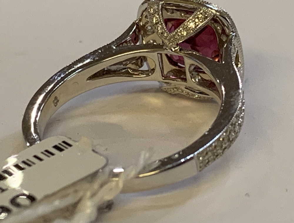 An 18ct white gold diamond and rubellite ring with pierced shoulders and raised platforms, size N, - Image 3 of 4