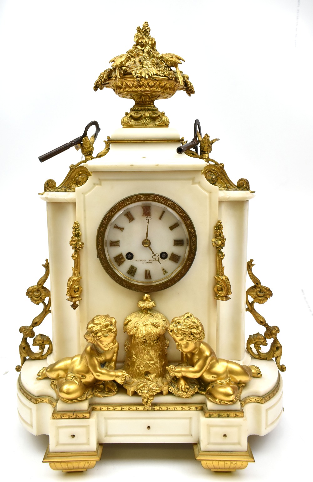 A late 19th century white marble, ormolu and gilt metal mounted mantel clock, the circular dial