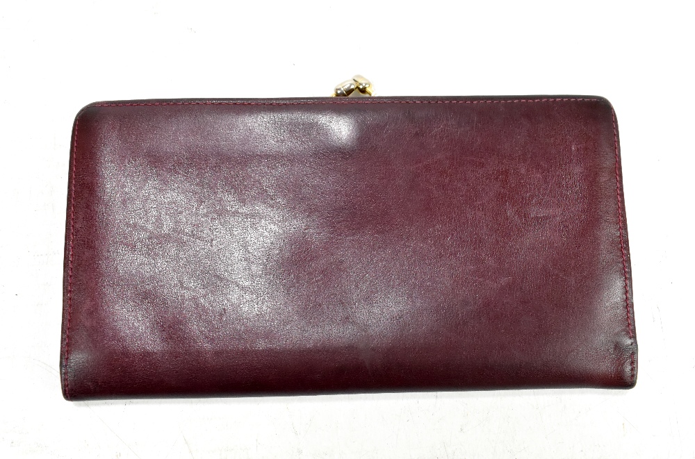 ASPREY OF LONDON; a vintage burgundy leather purse/card wallet, 18 x 9 x 2cm.