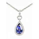 An 18ct white gold diamond and tanzanite pear shaped pendant, the tanzanite weighing 3.69cts