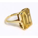 A yellow metal topaz dress ring, the inner band stamped 585, sold with original receipt from 1969,