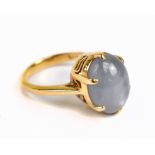 A yellow metal white star sapphire dress ring, approx 7.1g, size M.