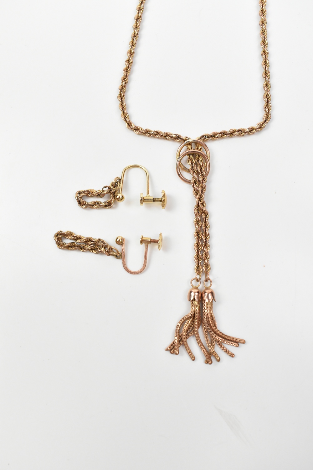 A 9ct yellow gold rope twist necklace with tassel drops, and a pair of drop earrings with screw